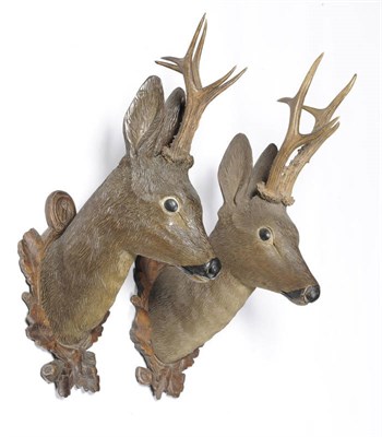 Lot 1183 - A Pair of Austrian Carved, Polychrome Wood and Antler Mounted Roe Deer Heads, circa 1885,...