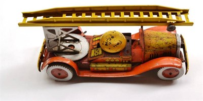 Lot 104 - A Clockwork Tinplate Fire Engine, lithographed in orange and yellow, with bell and extending ladder