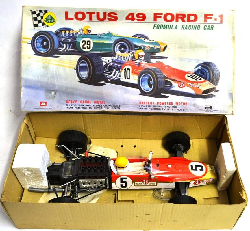 Lot 113 - Asahi (Japan) Battery Operated Lotus 49 Ford F1 red/gold/white tinplate body with plastic...