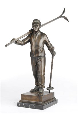 Lot 1195 - H.S. (Munich), circa 1930: A Bronze Figure of an Alpine Skier, standing with skis across his...