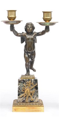 Lot 1198 - A Bronze and Gilt Brass Figural Candelabra, French, 19th century, as a putto upholding two...