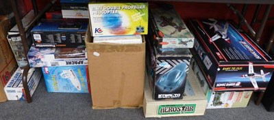 Lot 194 - A Collection of Boxed Remote Control Aircraft and Boats, remote controls and balsa models,...