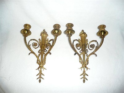 Lot 1201 - A Pair of Ormolu Two-Branch Wall Sconces, French, circa 1900, as flambeau torches supporting...