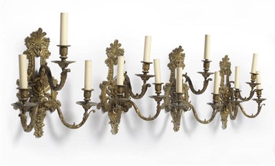 Lot 1203 - A Set of Four Ormolu Three-Branch Wall Appliqués, French, circa 1900, with anthemion, female...