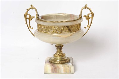 Lot 1206 - An Ormolu Mounted Pedestal Urn, French, circa 1900, of campana shape, with scrolling handles...