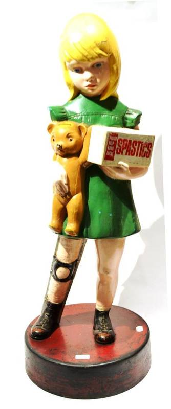 Lot 320 - Spastics Society Street Collecting Box in the form of a young girl holding a teddy bear and a...