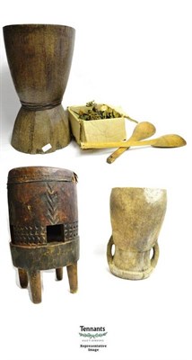 Lot 331 - Film Set Memorabilia, comprising three African mortars, a drum and five wooden spoons, used as...