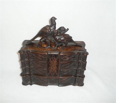 Lot 1215 - An Austrian "Black Forest" Carved and Stained Linden Wood Serpentine Fronted Jewellery Box,...