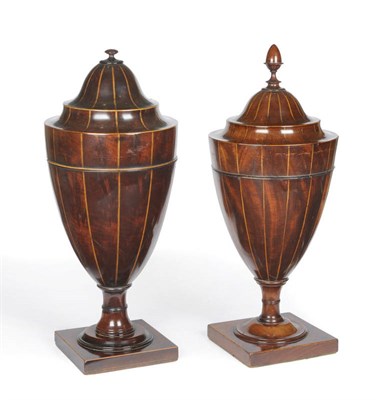 Lot 1218 - Two Similar George III Mahogany Pedestal Urn Knife Boxes, circa 1790, each with concave edged...