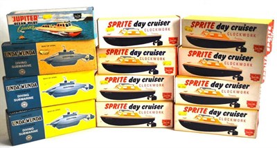 Lot 50 - Twelve Boxed Sutcliffe Clockwork Boats, comprising three tinplate Unda-Wunda Diving Submarines,...