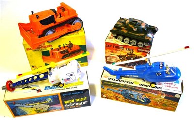 Lot 101 - Four Boxed Marx Battery Operated Plastic Toys - Junior Bulldozer, Cap Firing Tank, Chop Chop...