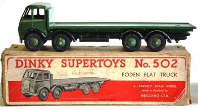 Lot 215 - A Boxed Dinky Supertoys Foden Flat Truck No.502, 1st cab type, with dark green cab, back and...