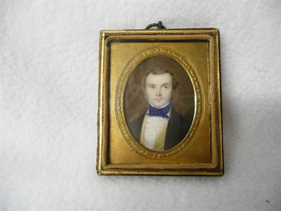 Lot 1240 - English School, mid 19th century: Portrait Miniature of a Gentleman, with brown hair and sideburns