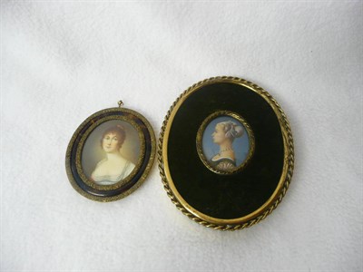 Lot 1242 - Continental School, early 20th century: Portrait Miniature of a Pretty Young Woman, her brown...