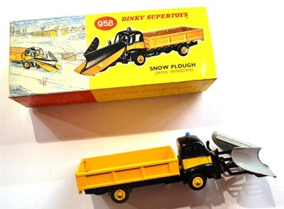 Lot 250 - A Boxed Dinky Supertoys Snow Plough No.958, with yellow and black body, silver plough, in pictorial