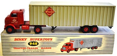 Lot 251 - A Boxed Dinky Supertoys McLean Tractor-Trailer No.948, with red cab, red hubs, plastic back, in...