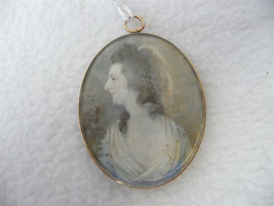 Lot 1244 - English School, circa 1790: Portrait Miniature of a Lady, with long brown curly hair and...