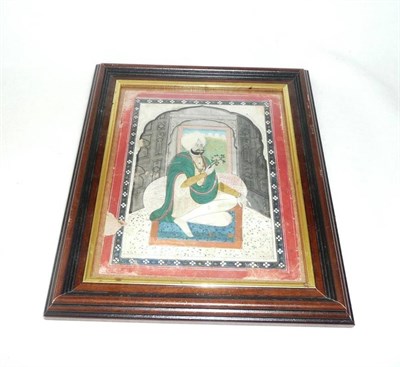 Lot 1245 - A Sikh Miniature Painting, perhaps 18th century, depicting a turbaned gentleman seated on a...