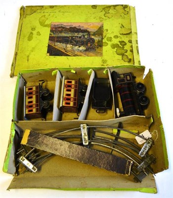 Lot 4 - A Boxed Bing 'O' Gauge Clockwork Tinplate Trainset, containing an 0-4-0 locomotive and tender...