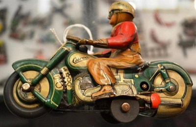 Lot 62 - A Schuco Clockwork Tinplate 'Curvo 1000' Motorcycle Rider, with green motorcycle, the rider...