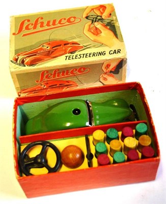 Lot 64 - A Boxed Schuco Clockwork Tinplate Telesteering Car 3000, in green, with steering wheel, key and...