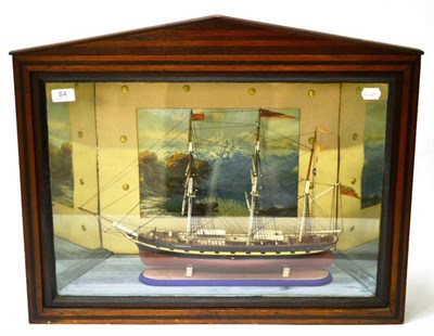 Lot 84 - A Wooden Cased Model of a Triple Masted Ship 'Guiding Star', with scenic backdrop, mirrored...