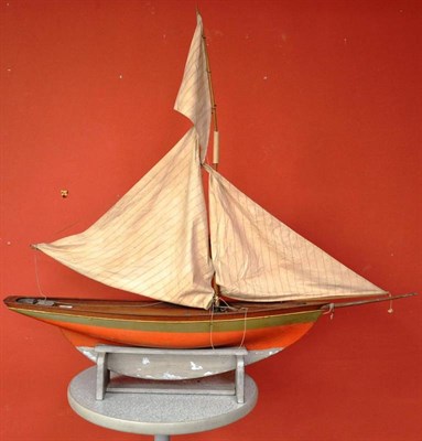 Lot 85 - A Wooden Pond Yacht, with red painted hull, lead keel, wooden mast, cloth sails, length of hull...