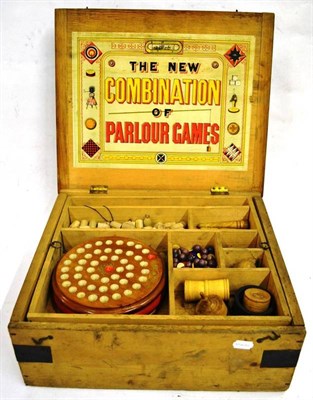 Lot 163 - A Boxed 'New Combination of Parlour Games' Compendium, containing Aunt Sally toy, hoopla,...