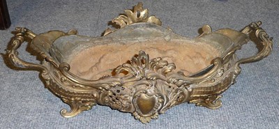 Lot 1270 - A Gilt Metal Planter of Bombe Shape, circa 1890, the acanthus carved wavy rim above opposing...