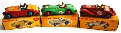 Lot 281 - Three Boxed Dinky Open Top Sports Cars:- M.G. Midget Sports No.108, with red body, tan interior, RN