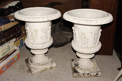 Lot 1274 - A Large Pair of Cast Iron Campana Garden Urns, 20th century, each with tong and dart everted...