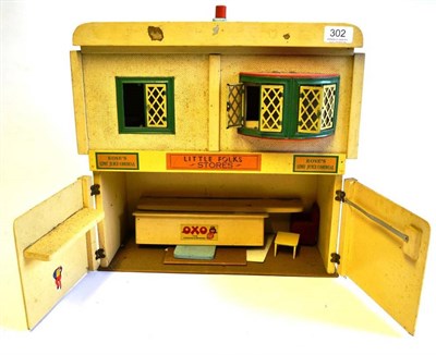 Lot 302 - A Wooden Model of a Shop - Little Folks Stores, two storey shop, with hinged and sliding front...