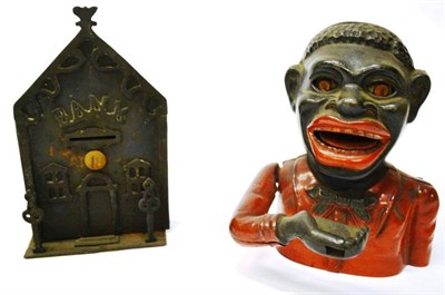 Lot 318 - A Cast Iron 'Jolly Nigger' Mechanical Money Bank, with good enamelled paintwork and pierced...