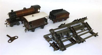 Lot 12 - A Bassett-Lowke 'O' Gauge Clockwork 4-4-0 'Duke of York' Locomotive and Tender No.1927, in gilt...