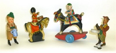 Lot 53 - Four Clockwork Tinplate Toys, comprising a Schuco Bavarian beer drinker, a Brimtoys mounted...