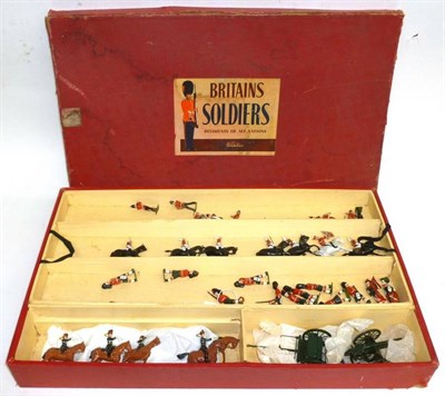 Lot 83 - A Boxed Britains Post War Lead Soldier Set No.73, containing Bandsmen, Highlanders, Artillery,...