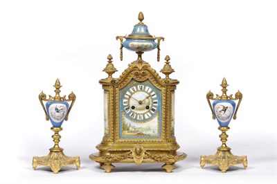 Lot 1292 - A French Gilt Metal and Porcelain Mounted Striking Mantel Clock with Garniture, circa 1880, the...