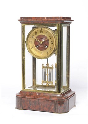 Lot 1294 - A Red Marble Four Glass Striking Mantel Clock, circa 1890, the case with four bevelled glass...