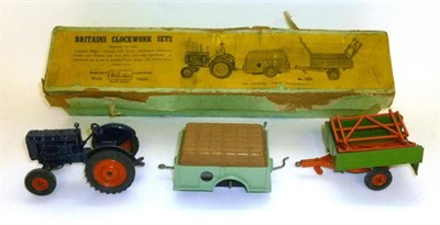 Lot 133 - A Boxed Britain's Clockwork Tractor Set No.137F, comprising a Fordson Major tractor (no...