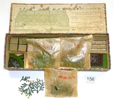 Lot 156 - A Boxed Britains Lead Miniature Garden Set 12MG, containing three packs of flowers and shrubs,...