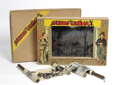 Lot 164 - An 'Ombro Cinema' Toy Shadow Theatre, with lithographed wooden frame featuring Charlie Chaplin,...