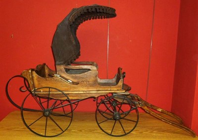 Lot 175 - A Reproduction Wooden Dog Cart, the cloth hood and seat decorated with tassels, with steel...