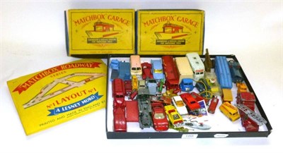 Lot 188 - A Collection of Diecast Vehicles and Accessories, including two boxed Matchbox Garages,...