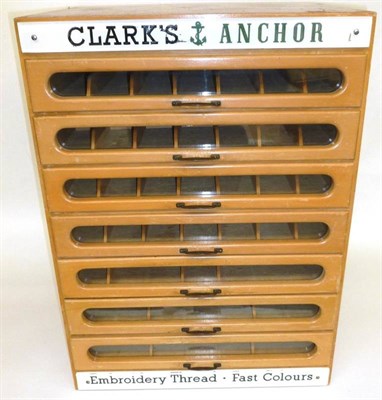 Lot 238 - A Clark's Anchor Seven Drawer Wooden Sewing Cottons Chest, with glazed drawer fronts and...