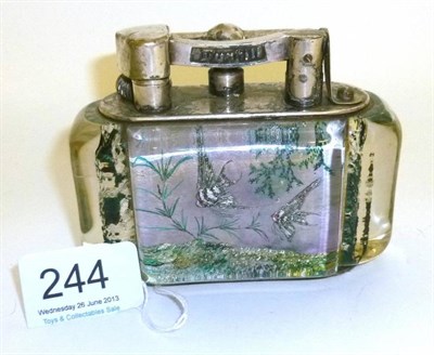 Lot 244 - A Dunhill Aquarium Petrol Table Lighter, with plated metal mounts and lucite panels decorated...