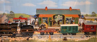 Lot 9 - A Hornby Pre and Post War 'O' Gauge Railway Diorama, some items boxed, diorama includes a pre...