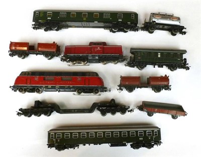 Lot 19 - A Small Collection of Marklin 'HO' Gauge Trains and Accessories, including two locomotives, two...