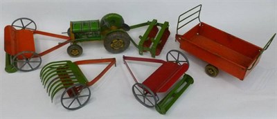 Lot 47 - A Mettoy Tinplate Tractor, lithographed in green, with grey tyres, together with five farming...