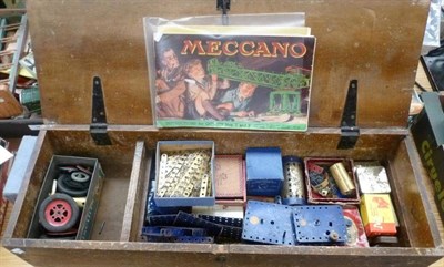 Lot 51 - A Collection of Meccano, including blue and gold pieces, four motors, wheels and cogs, manuals...