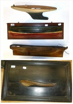 Lot 56 - Two Half Block Wooden Models of Boats, together with a carved wooden hull and a small pond...